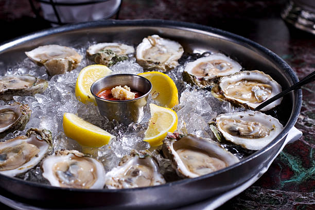 Fresh oysters over ice with lemon wedges at The Lazy Butcher